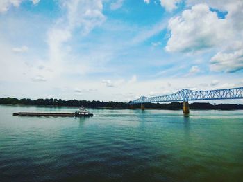 Scenic view of bridge over sea against sky