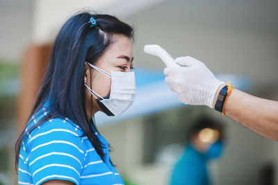 Portrait of woman with arms outstretched