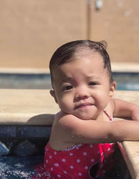 Portrait of cute girl  in swimming pool