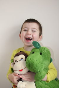 Portrait of cute boy with toy