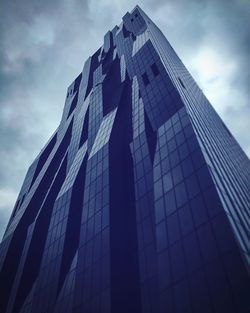 Low angle view of office building against sky