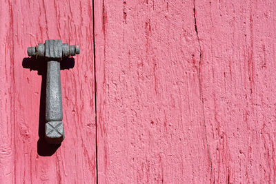 Close-up of door knocker on wall