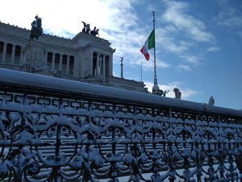 Low angle view of flag against sky