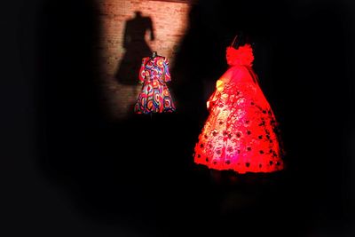 Close-up of christmas decoration hanging against black background