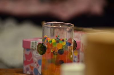 Close-up of glass of jar on table