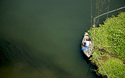 High angle view of boat moored on river