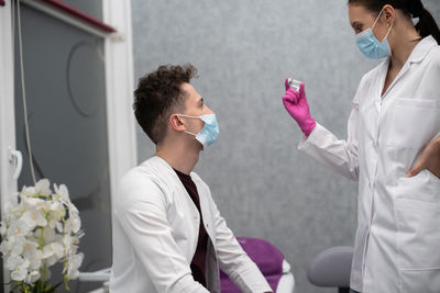 Side view of doctor examining patient