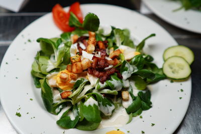 Close-up of salad served in plate on table