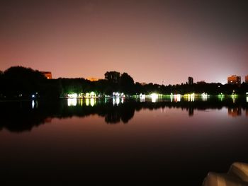 Scenic view of lake against sky at night