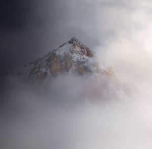 Scenic view of snowcapped mountain against sky