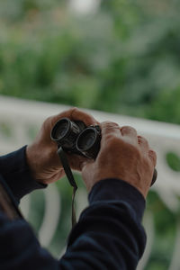 Close-up of man holding camera