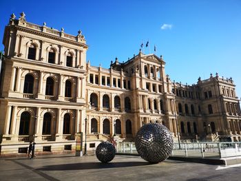 Low angle view of building against blue sky