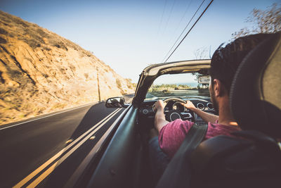 Woman cycling in car