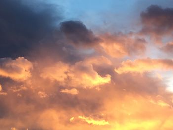 Low angle view of cloudy sky during sunset