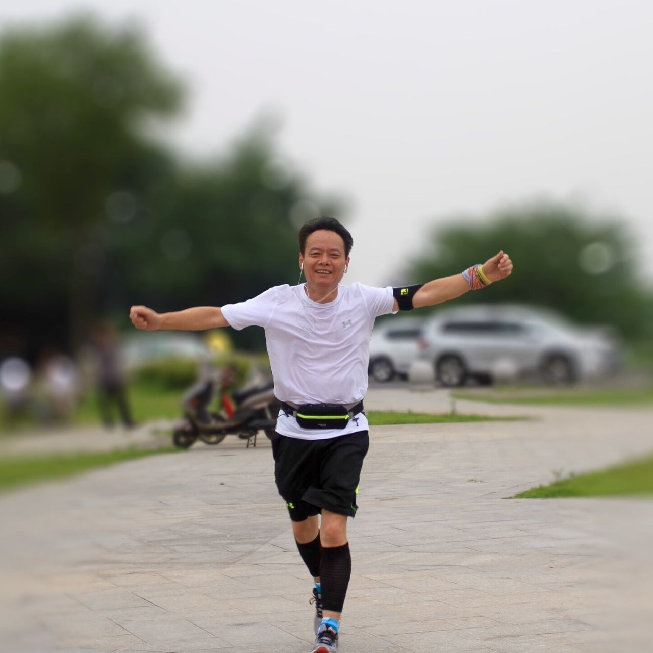 full length, casual clothing, lifestyles, childhood, leisure activity, mid-air, person, focus on foreground, boys, elementary age, girls, jumping, running, fun, front view, happiness, arms outstretched, enjoyment