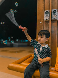 Portrait of boy playing bubbles 