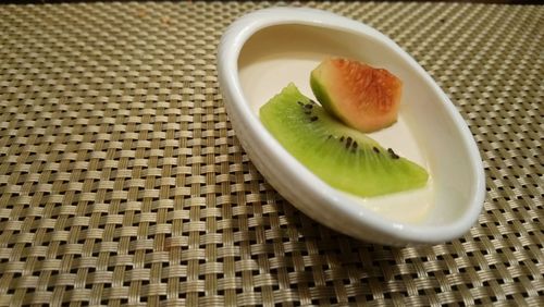 High angle view of fruits in plate on table