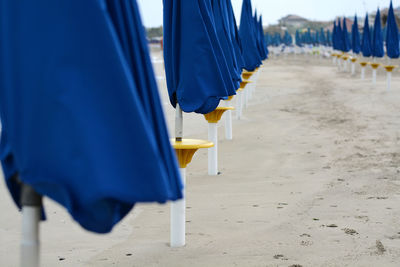 Row of deck chairs on beach