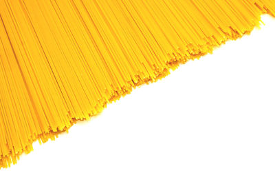 Close-up of yellow umbrella against white background