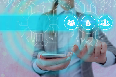 Digital composite image of man using mobile phone