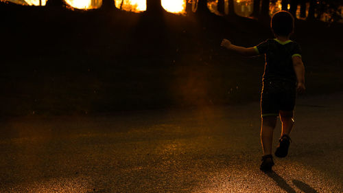 Boy running at night
