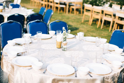 Plates and glasses arranged on table