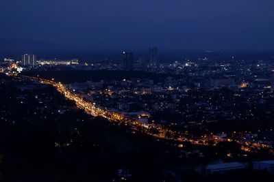 High angle view of illuminated buildings in city at night