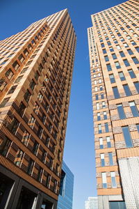 Low angle view of modern buildings against sky