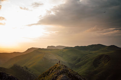 Scenic view of landscape against sky during sunset