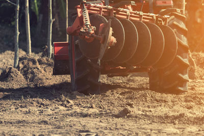 Machinery on field during sunny day