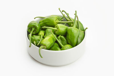 Close-up of vegetables in bowl against white background