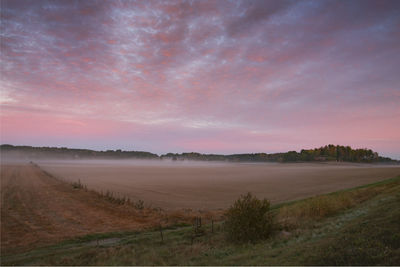Scenic view of landscape against sky during sunset