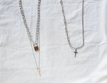 High angle view of chain on bed