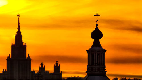 Silhouette of building at sunset