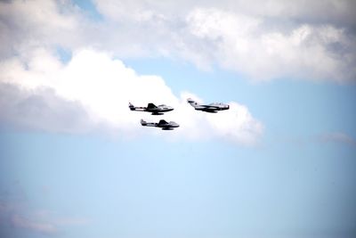 Low angle view of airplane flying in sky