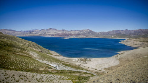 Scenic view of sea against clear blue sky