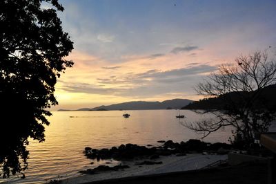 Scenic view of sea against sky at sunset