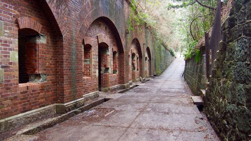 Narrow street leading to old building