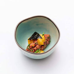 High angle view of food in bowl on white background