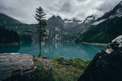 Scenic view of lake and mountains against sky