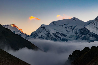 Scenic view of mountains against sky during sunset