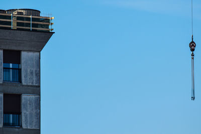 Low angle view of building against clear blue sky