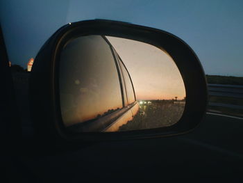 Reflection of car on side-view mirror