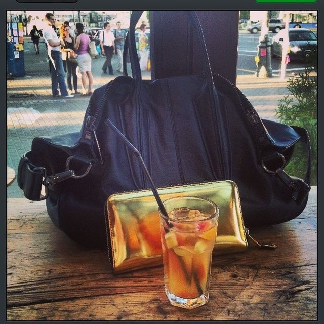 table, drink, food and drink, lifestyles, transfer print, men, person, sitting, leisure activity, incidental people, refreshment, auto post production filter, focus on foreground, restaurant, drinking glass, chair, day, sidewalk cafe