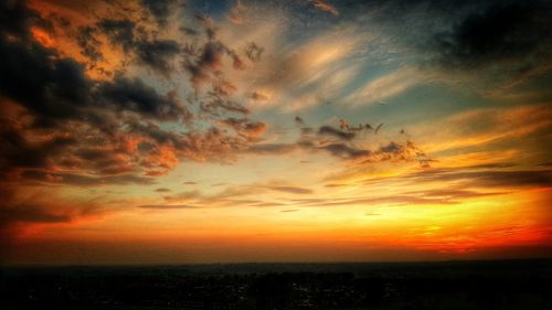 Scenic view of dramatic sky during sunset