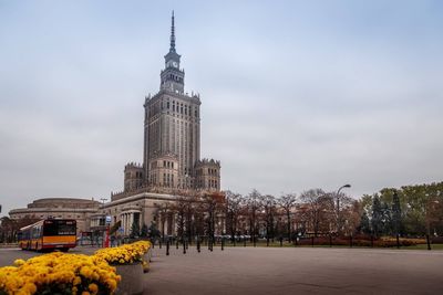 Buildings against cloudy sky