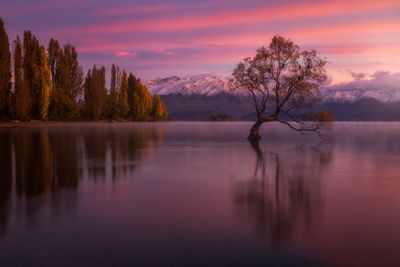 Scenic view of lake against sky during sunset