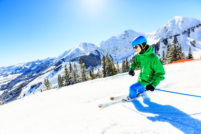 Man skiing on snow covered mountain