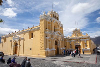 Group of people in front of historic building