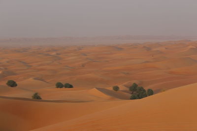 Scenic view of desert against clear sky